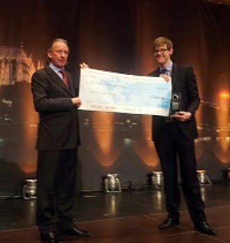 click/tap to enlarge this image... Lewis receiving his trophy and a cheque.