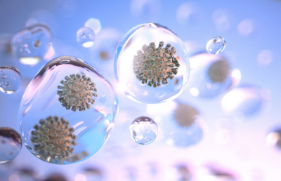 Coronavirus particles spread through tiny droplets of liquid floating through the air. Credit: fpm/iStock.com
