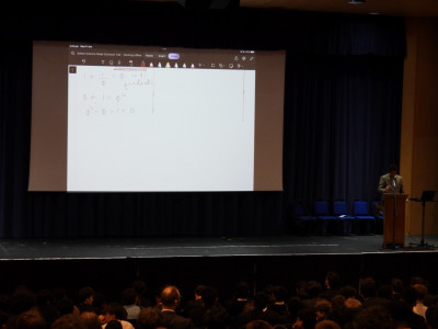Dr Shah working through the mathematics problems