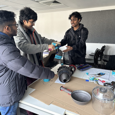 Students building a prototype using spare Dyson parts