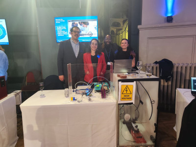 Sobrido's team (Hattie Chisnall, Carlos Mingoes, Ana Sobrido and Michael Thielke) stand at the Night of Science and Engineering.