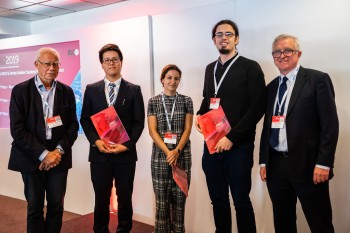 Eduardo (2nd right) being congratulated with the other prize winners by Prof Jacques Noordermeer, the Executive Chairman of IRCO (left) and Steve Sheppard, the CEO of Derby Rubber (right), the two prize sponsors.