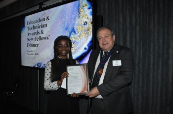 Adaeze being awarded the Royal Charter Award by the IOM3 President Martin Cox