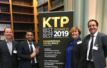 Pictured at the award ceremony (from left to right) are:  Emiliano, Harshit (holding the trophy), Jan Stringer (our KTP advisor) and James.