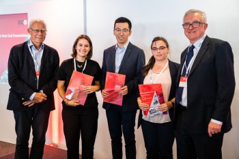 Leihao Chen (centre) being congratulated with the other prize winners by Prof Jacques Noordermeer, the Executive Chairman of IRCO (left) and Steve Sheppard, the CEO of Derby Rubber (right), the two prize sponsors.
