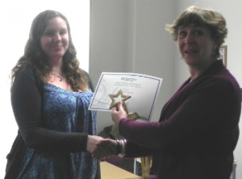 Eleanor Roake accepts the prize from Dean for Taught Programmes in Science and Engineering, Professor Julia Shelton 