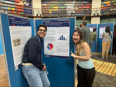 click/tap to enlarge this image... Dr Shah and his student at the poster showcase
