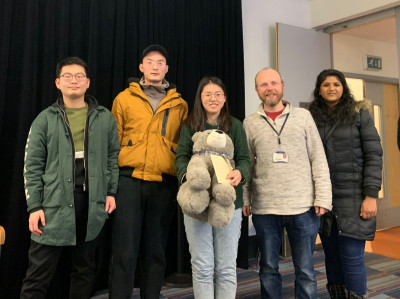 Qinrong celebrating after her viva with some of the research group