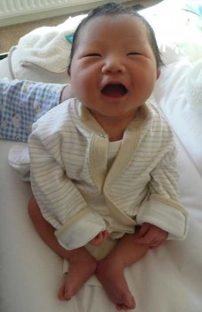 click/tap to enlarge this image... Baby Aidan is laughing already