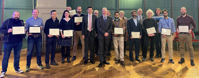 The in person recipients line up for a photo at the annual award ceremony. More than half of the staff in the photo are from SEMS.