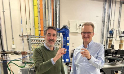 Dr Roberto Volpe and Dr Christoph Rau with biochar samples inside the I-13 beamline facility at Diamond Light Source. Credit: Diamond Light Source.