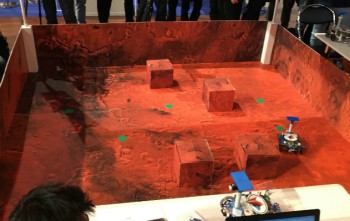 The robot had to navigate this terrain to find the green dots.