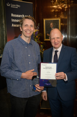 Jon HIlls being congratulated by Prof Colin Bailey at the awards ceremony