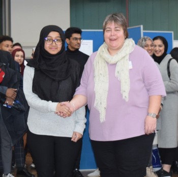 Rashna being congratulated by Dr Carolyn Small from Arconic, who is the Chair of the Materials Division Industrial Advisory Board.