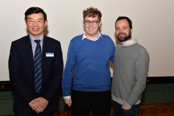 Jake is being congratulated by Wen Wang and Lorenzo Botto