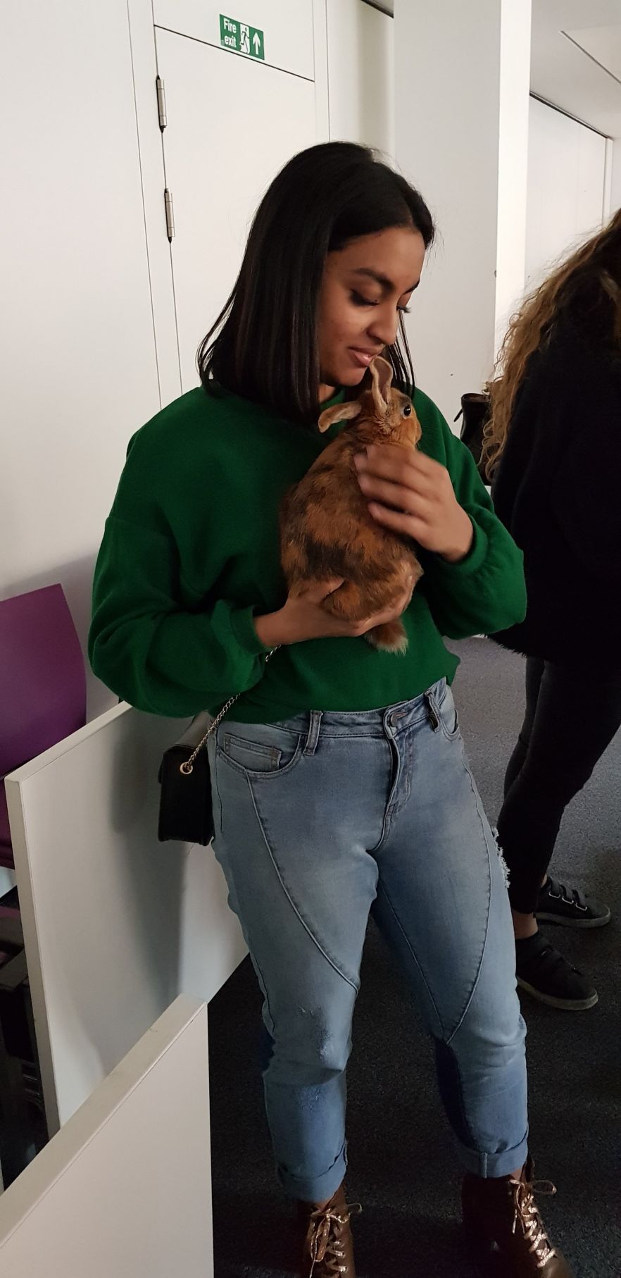 Anika with a rabbit, during a 'keep calm with animals' during study week