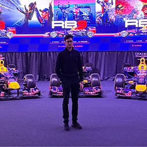 Farhal staning in front of some Red Bull racing cars