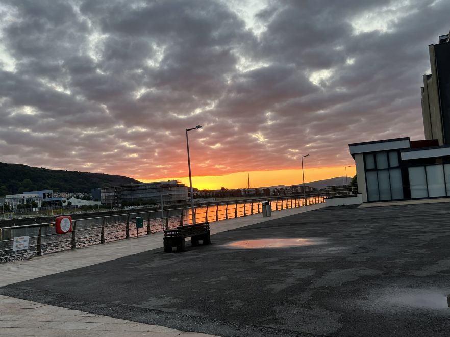 A sunset over the river in Swansea