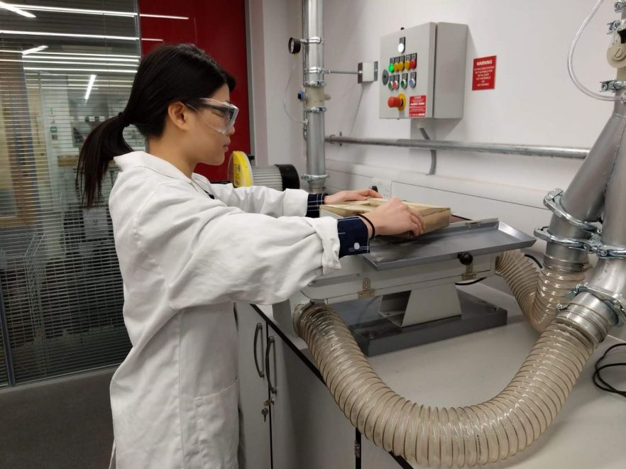 Tsu May Lim working in a lab