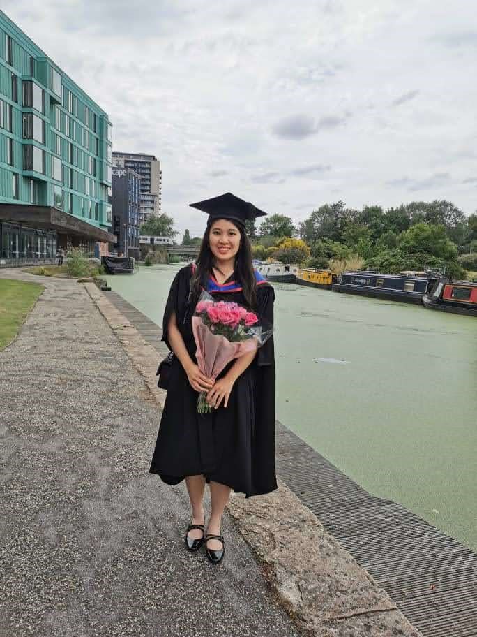 Tsu May Lim at canalside on her graduation day