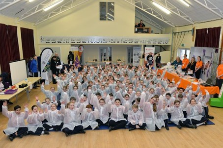 Group photo of school children as part of explaining the importance and excitement of bioengineering