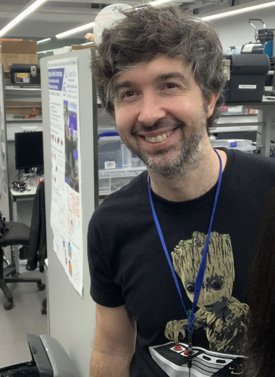 Lorenzo Jamone smiling in his lab